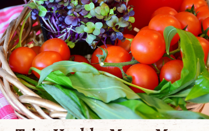 A basket of fresh vegetables and herbs.