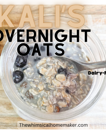 A mason jar on a wooden surface filled with creamy oatmeal and berries with a spoon.